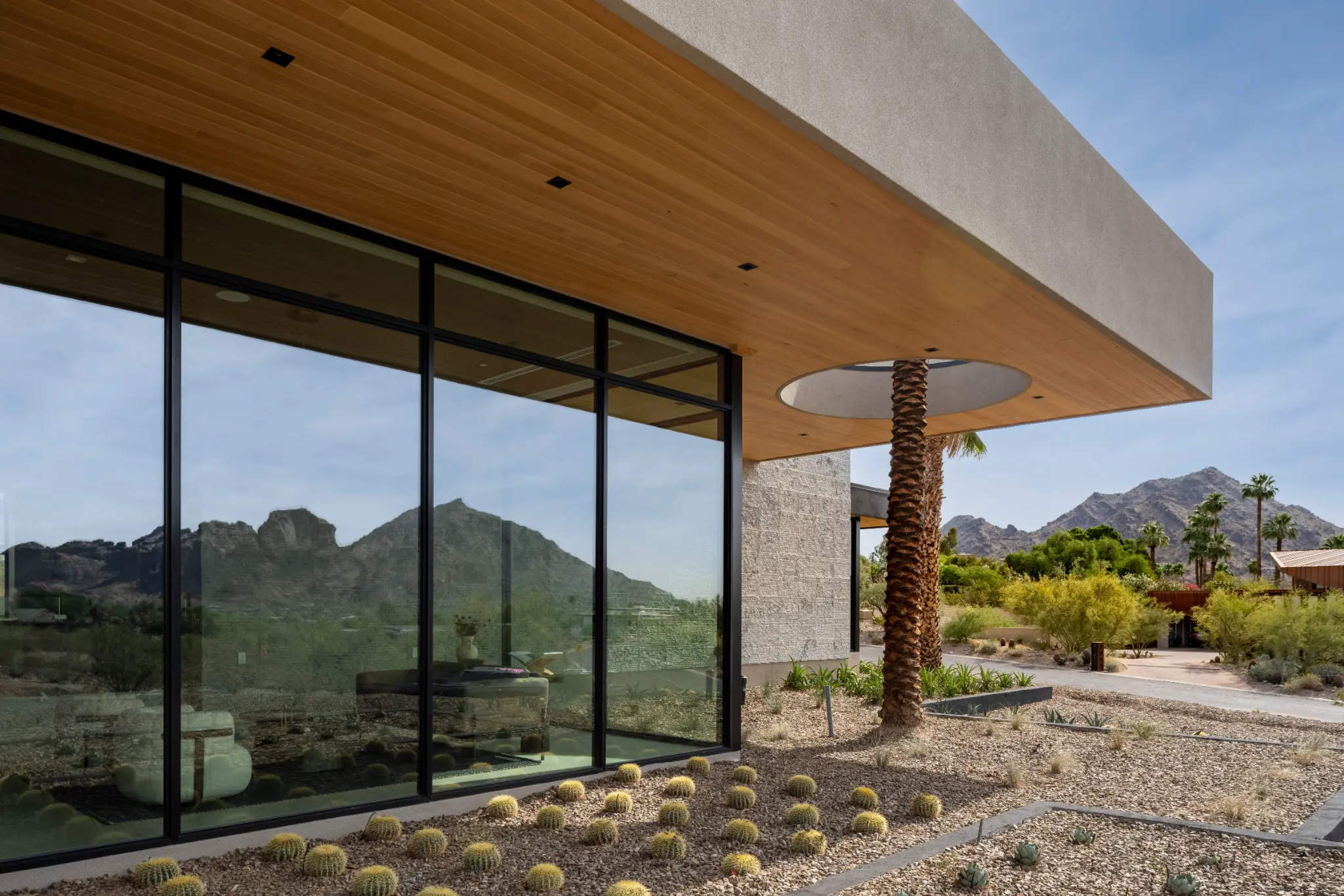 Glass exterior and desert landscaping at Indian Bend Estate