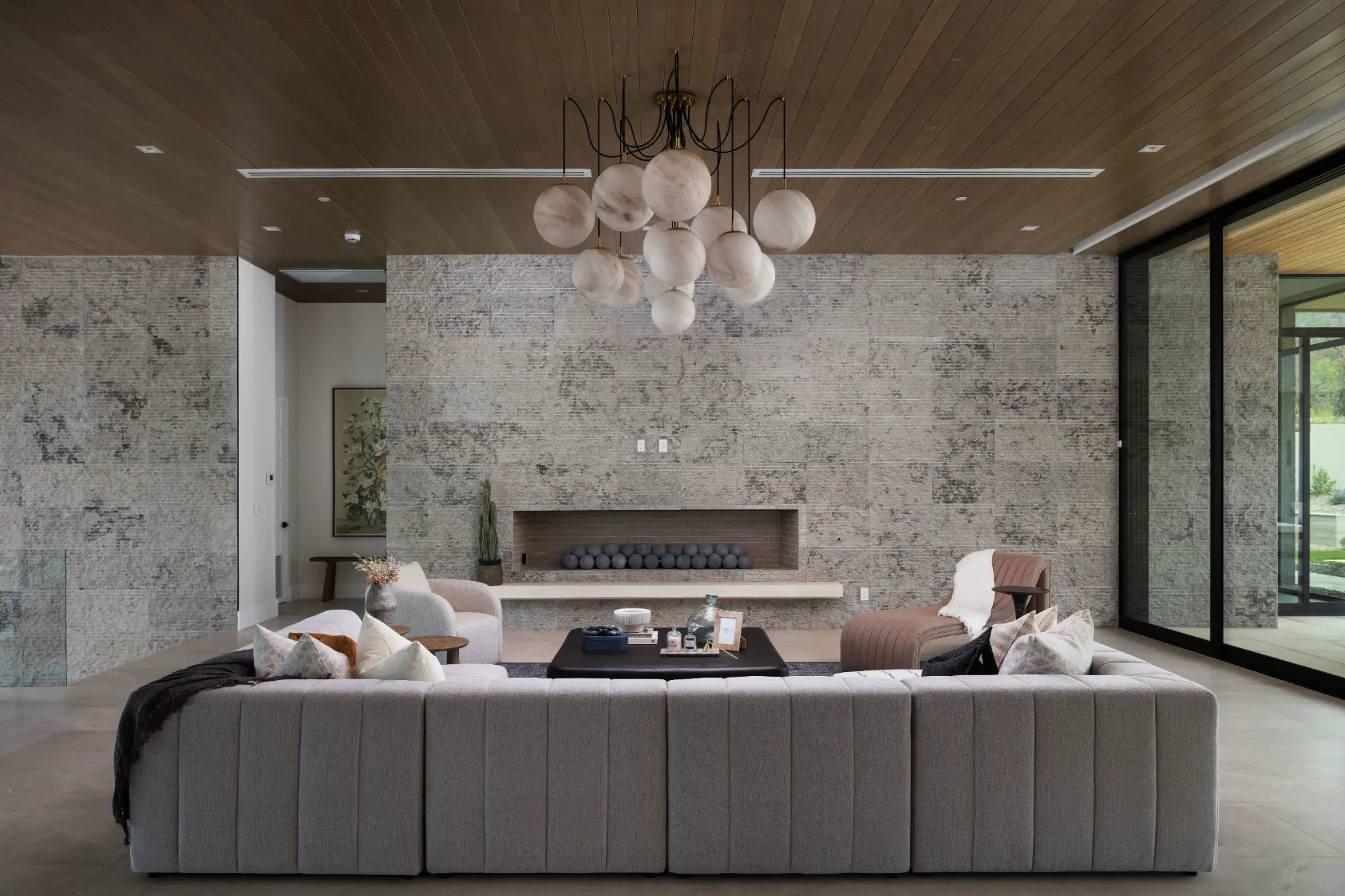 Living room with stone fireplace wall at Indian Bend Estate