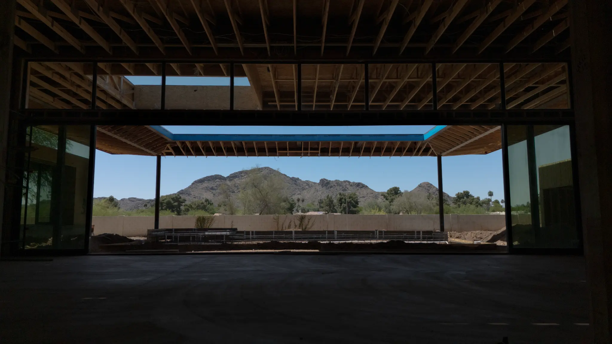 Construction-stage interior view toward mountains at Sanna Street Estate in Paradise Valley